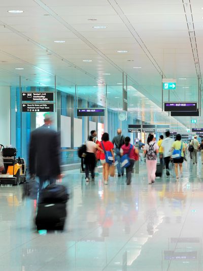 Foot traffic moving through airport terminal