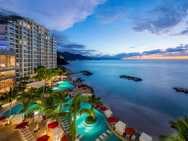 The pool and beach area at sunset at the Hilton Vallarta Riviera All-Inclusive Resort.