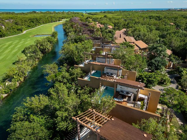 An aerial via over rooms at Banyan Tree Mayakoba that are overwater villas.