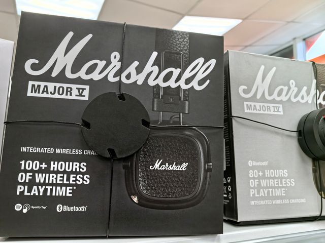 A box of Marshall Major V Headphones sitting on a store shelf with the security tag on.