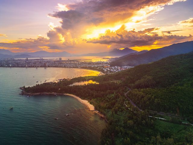 An aerial view of the coast of Da Nang, Vietnam, at sunset.