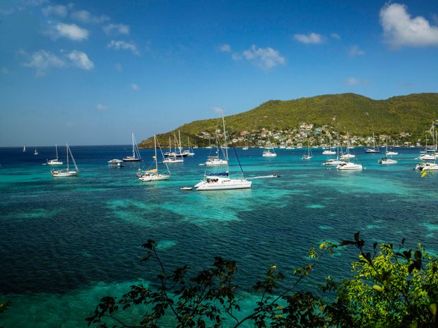 View of yachts and sail boats in the Caribbean harbor of Bequia Island in Saint Vincent and the Grenadines