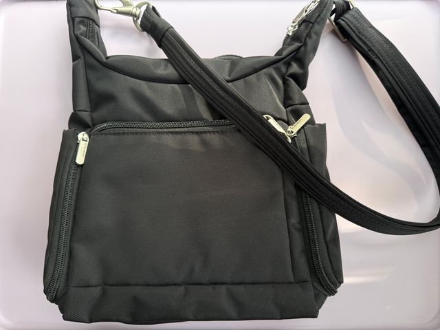 A black Travelon Anti-Theft Classic Messenger Bag set against a white background.