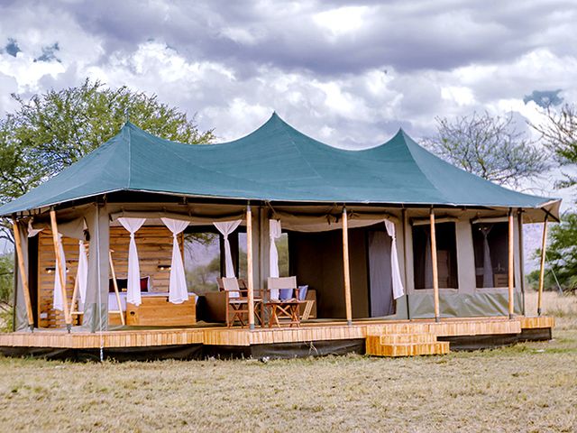 A tented structure on a wood platform at Ang’ata Kimarishe Camp.