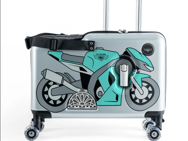 A ride-on Younglingz suitcase with a picture of a blue motorcycle on the outside.
