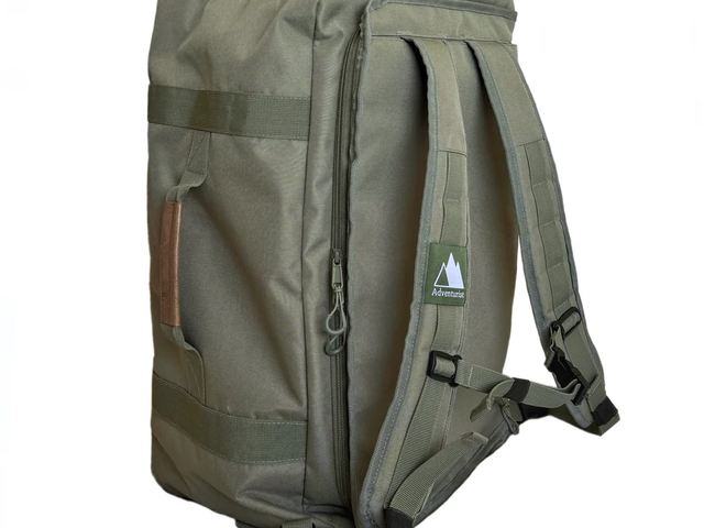 An olive-colored backpack against a white background.