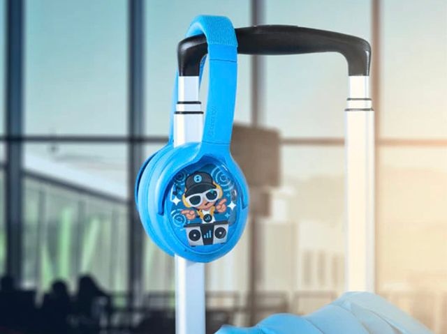 A pair of blue Onanoff BuddyPhones on the handle of a suitcase.