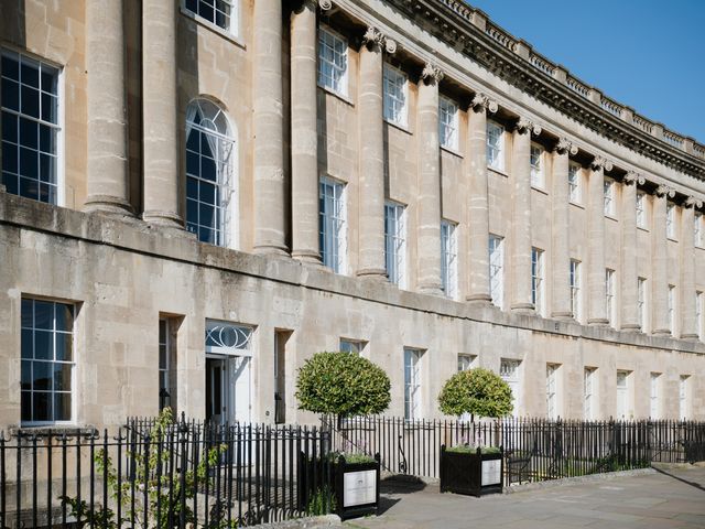 The entrance of Royal Crescent with columns and heavy stone walls.