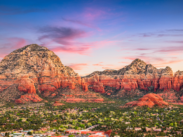 An aerial sunset view of rock formations in Sedona, Arizona.