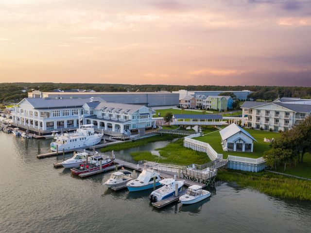 The Beaufort Hotel as seen from an aerial view over the water with a marina.