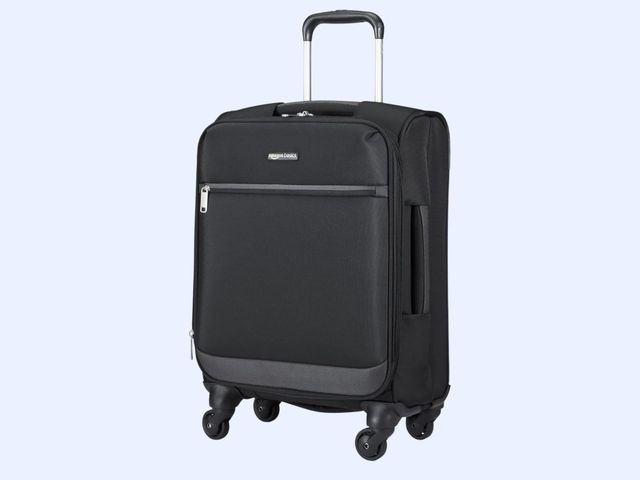 A black soft-sided wheeled carry-on suitcase against a blue background.