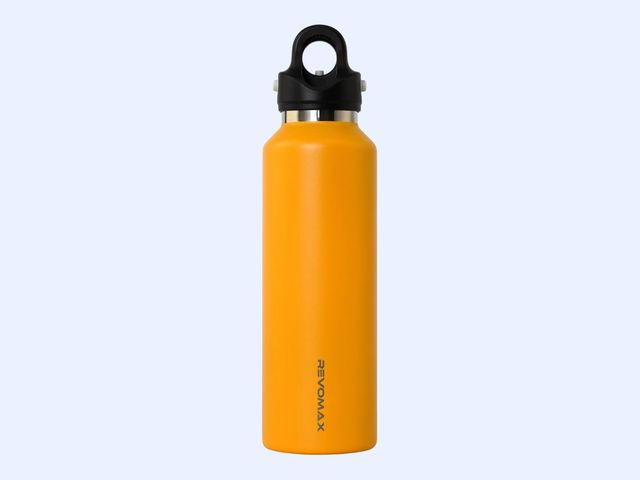 A metal orange water bottle with a black lid against a blue background.