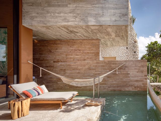 A hotel room at La Casa de la Playa in Mexico with a private pool.