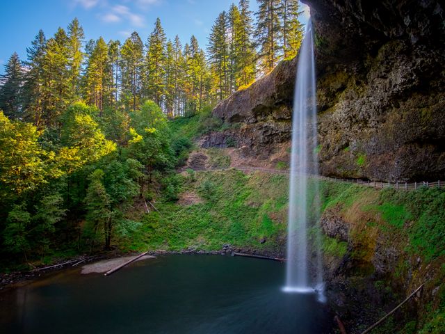 South Falls in Silver Falls State Park with sunlight streaming in from behind the falls.