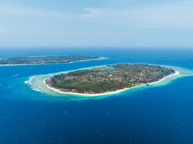 Aerial view of the coral reefs along the coast of Gili Air Island in Indonesia.