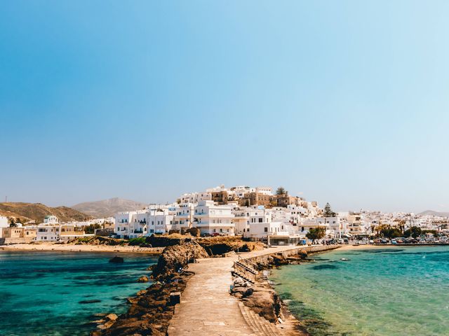 A land bridge pathway with sea water on each side leads to the center of Naxos.