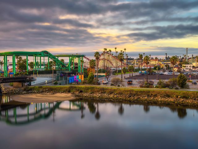 Sunrise over the Santa Cruz skyline, San Lorenzo River and the Santa Cruz Beach Boardwalk amusement park.
