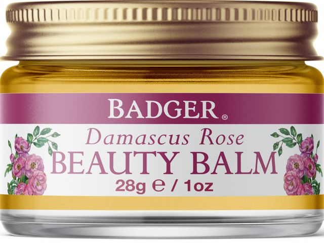 A tub of Badger Damascus Rose Beauty Balm against a white background.
