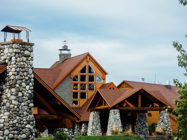 The woodsy looking exterior of Talkeetna Alaska Lodge with timber and stone.