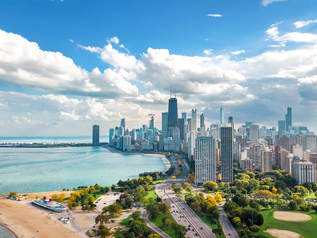 An aerial view of the skyline of Chicago over the water.