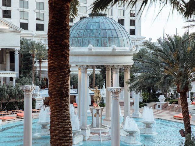 Roman columns and a statue next to fountains in the Gardens of the Gods pool at Caesars Palace in Las Vegas.