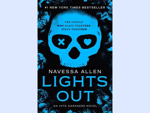 A black and light blue cover with a skull face that has an x in one eye socket and a heart in the other.