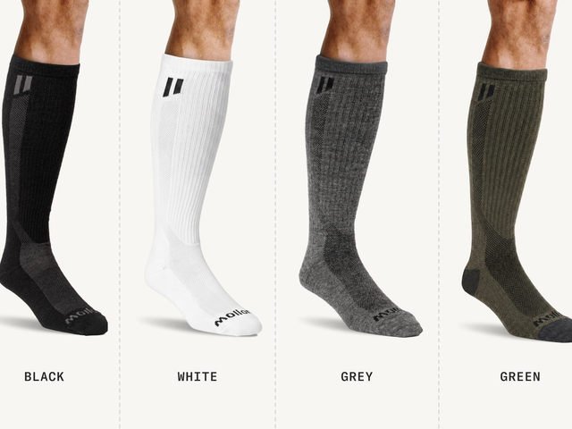 Four different socks side by side demonstrating the different color choices.