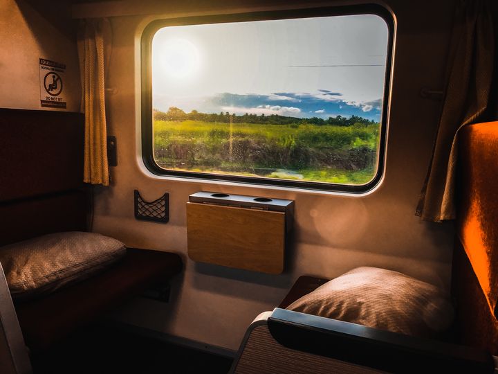 A scenic view outside of a train car window.