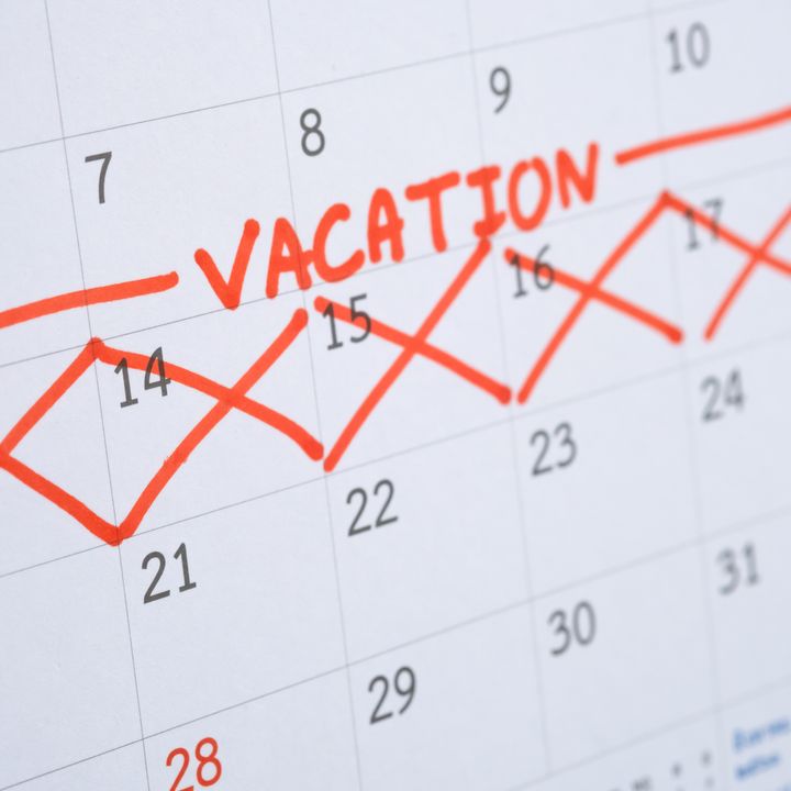 A week on a calendar is marked off with red Xs and the word ‘vacation.’