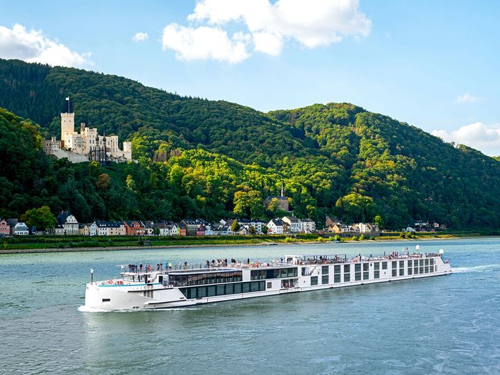 A Riverside Luxury Cruise ship sailing down a river in Europe.