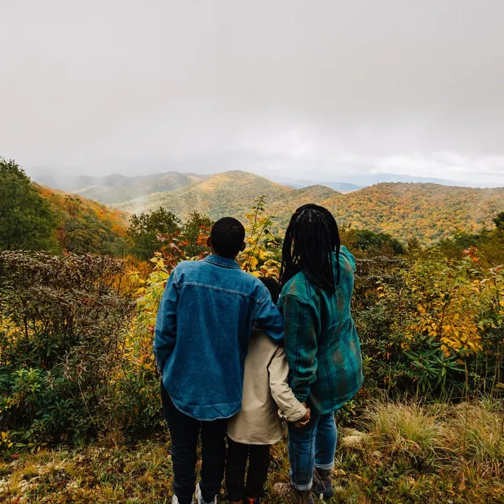 Family enjoying scenic fall foliage in the North Carolina Mountains