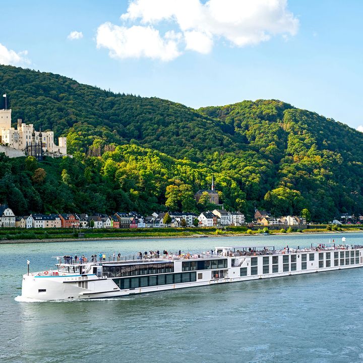 A Riverside Luxury Cruise ship sailing down a river in Europe.