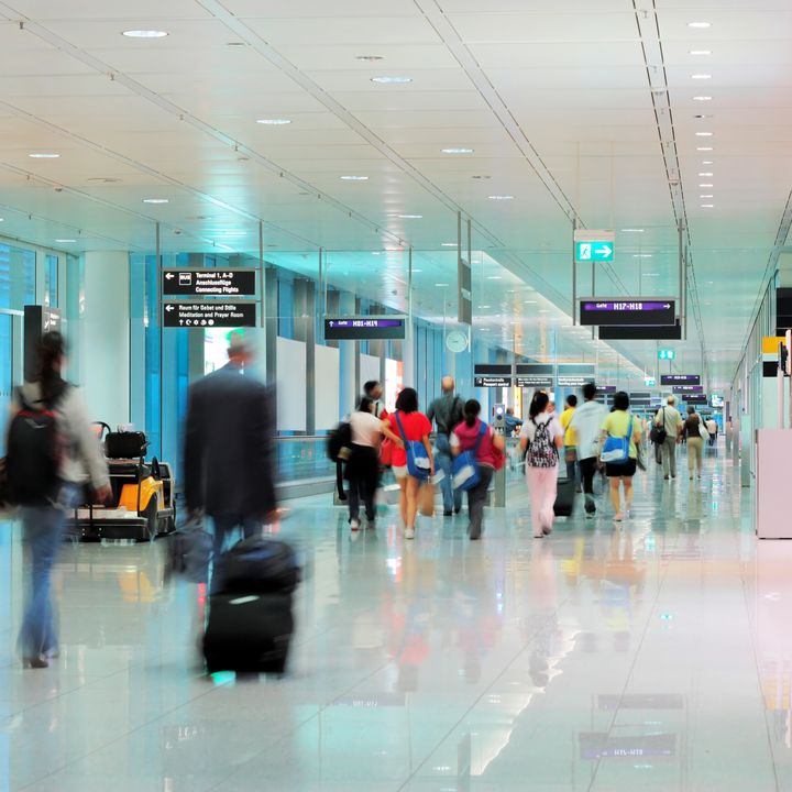 Foot traffic moving through airport terminal