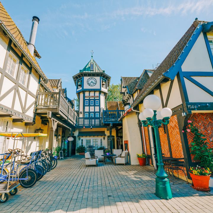 A brick-lined street in Solvang with traditional Danish timber architecture.