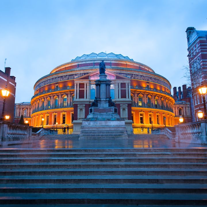 Steps leading up to the Royal Albert Hall Opera theater in London, England, at dusk.